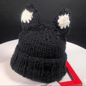 Hand knit woven hat with ears.